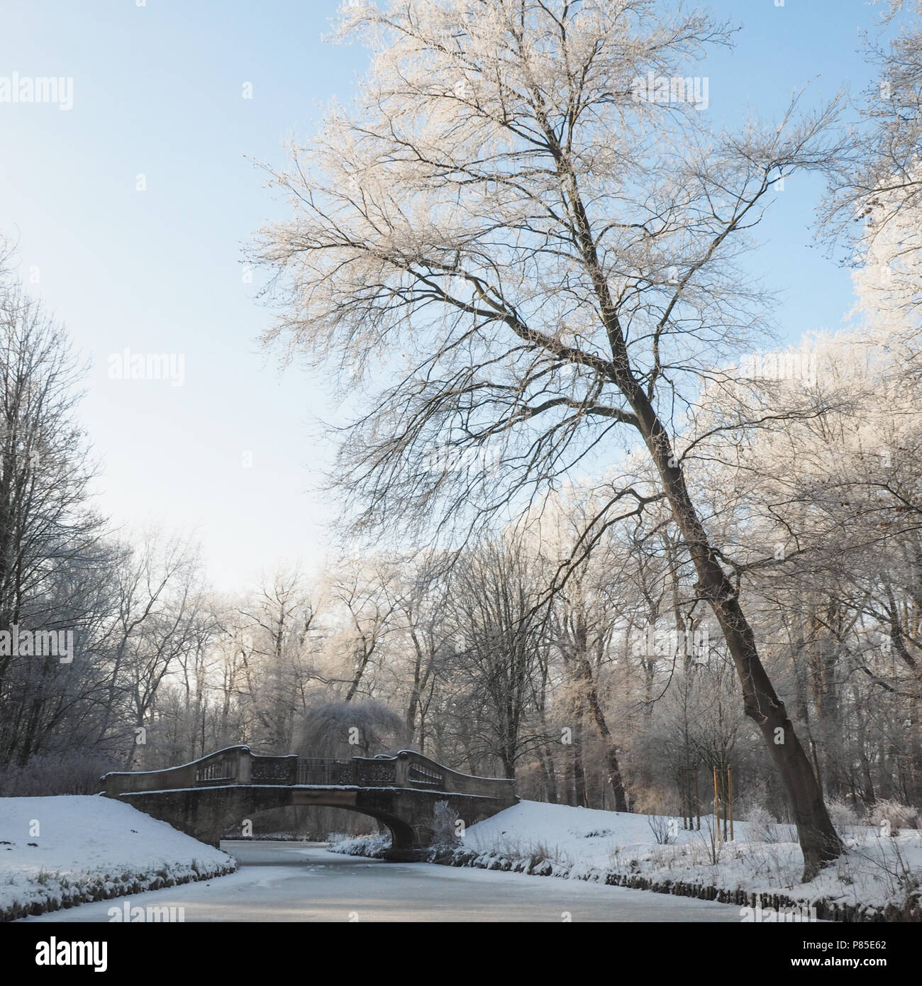 Landscape in winter with a frozen lake and a bridge Stock Photo - Alamy