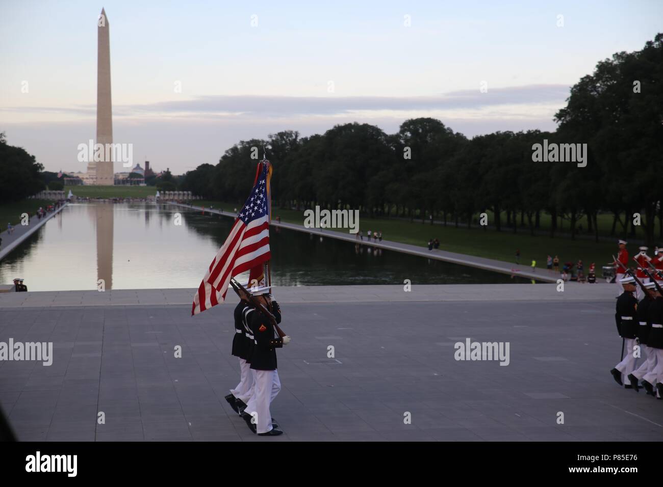 Marines with the U.S. Marine Corps Color Guard march the National Ensign and the U.S. Marine Corps Battle Colors across the parade deck during the Tuesday Sunset Parade at the Lincoln Memorial, Washington D.C. June 12, 2018, June 12, 2018. This year is the first year Barracks Marines are hosting Tuesday Sunset Parades at the Lincoln Memorial. The guest of honor for the parade was Secretary of the Interior Ryan Zinke and the hosting official was Robert D. Hogue, counsel for the commandant of the Marine Corps. () Stock Photo