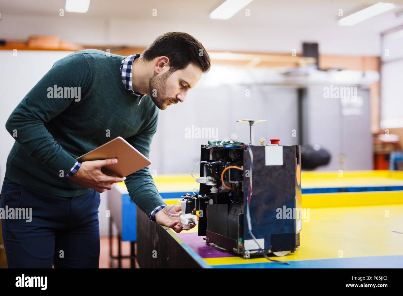 Young student of robotics working on project Stock Photo