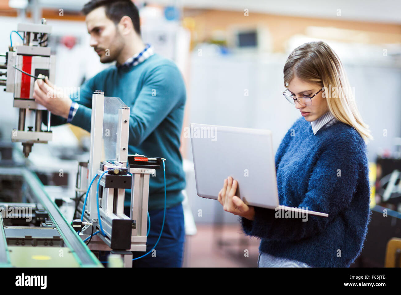 Young students of electronics working on project Stock Photo