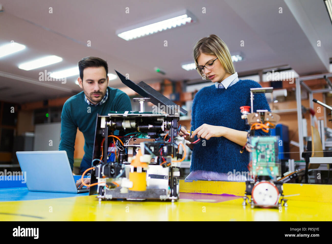 Young students of robotics working on project Stock Photo