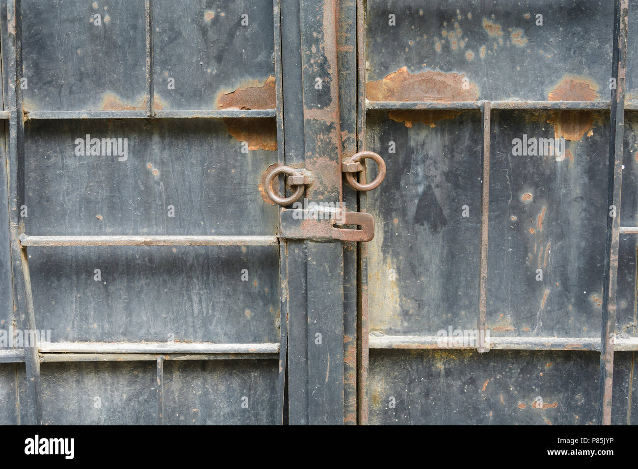 iron door with old opened lock with rusty rings Stock Photo - Alamy