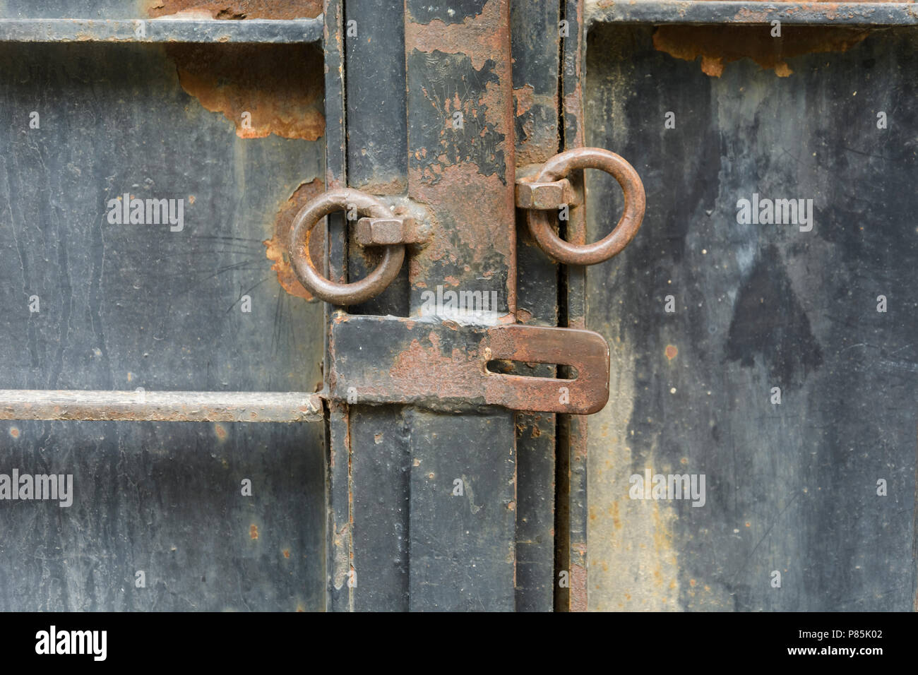 iron door with old opened lock with rusty rings Stock Photo - Alamy