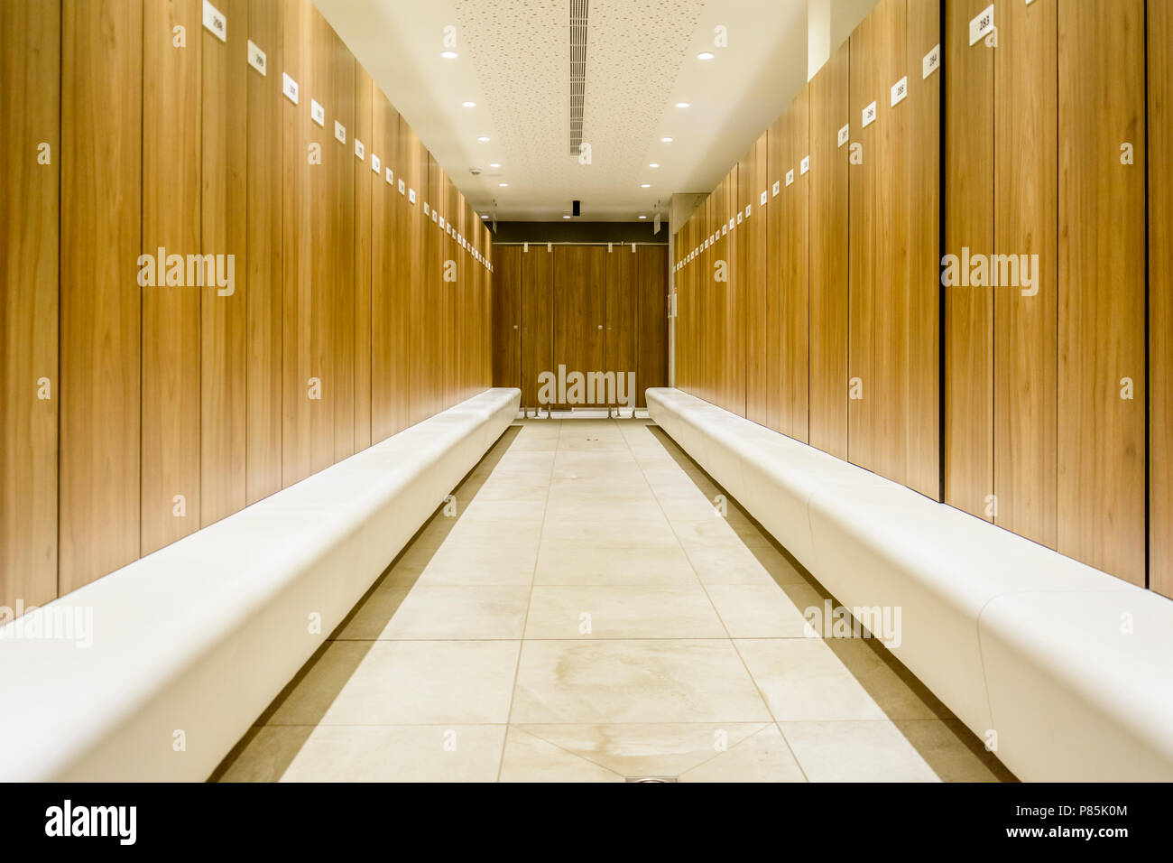 Modern Storage lockers in a swimming pool with bench , and led lighting Stock Photo