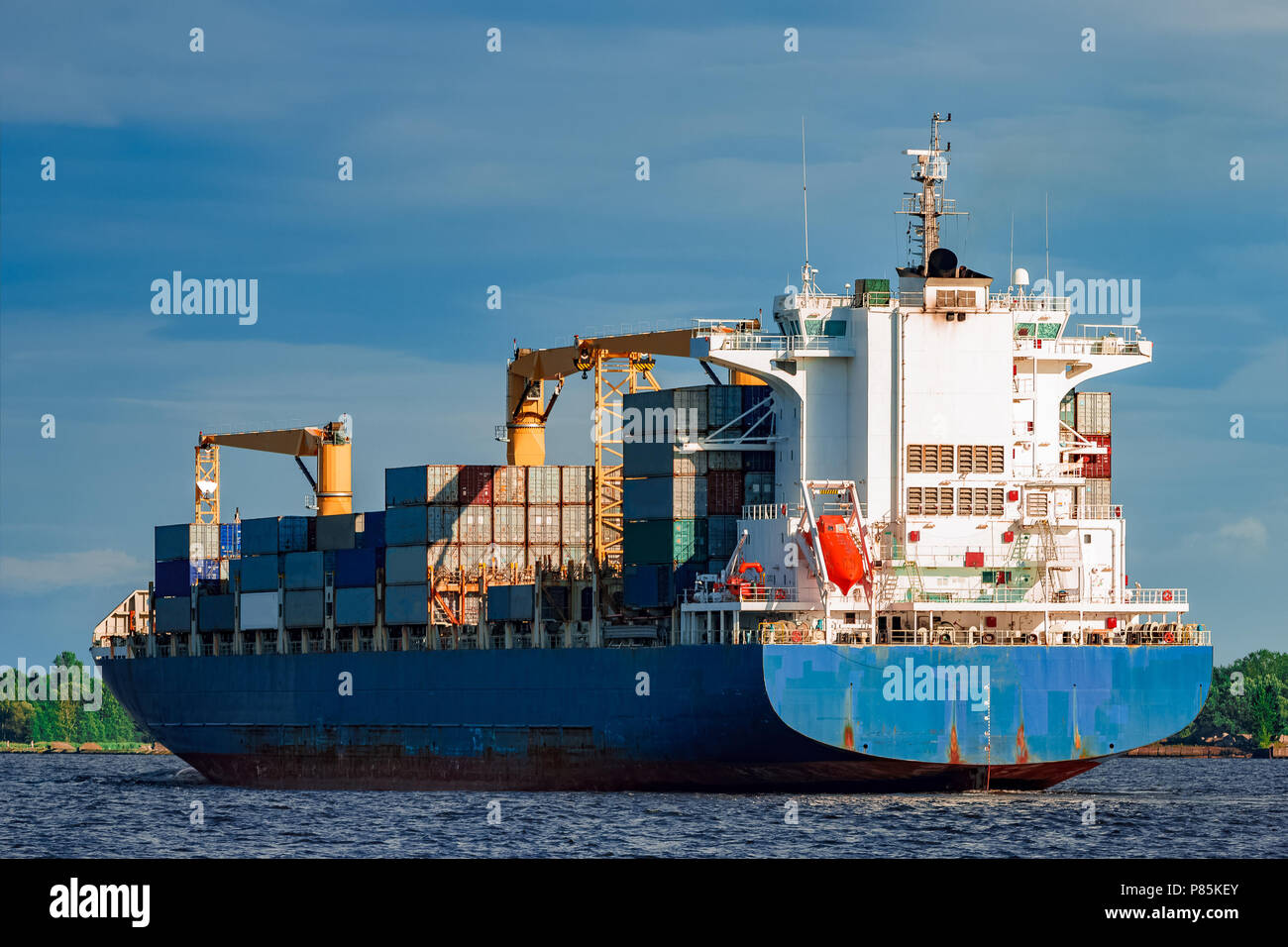 Blue container ship. World logistics and production transfer Stock Photo