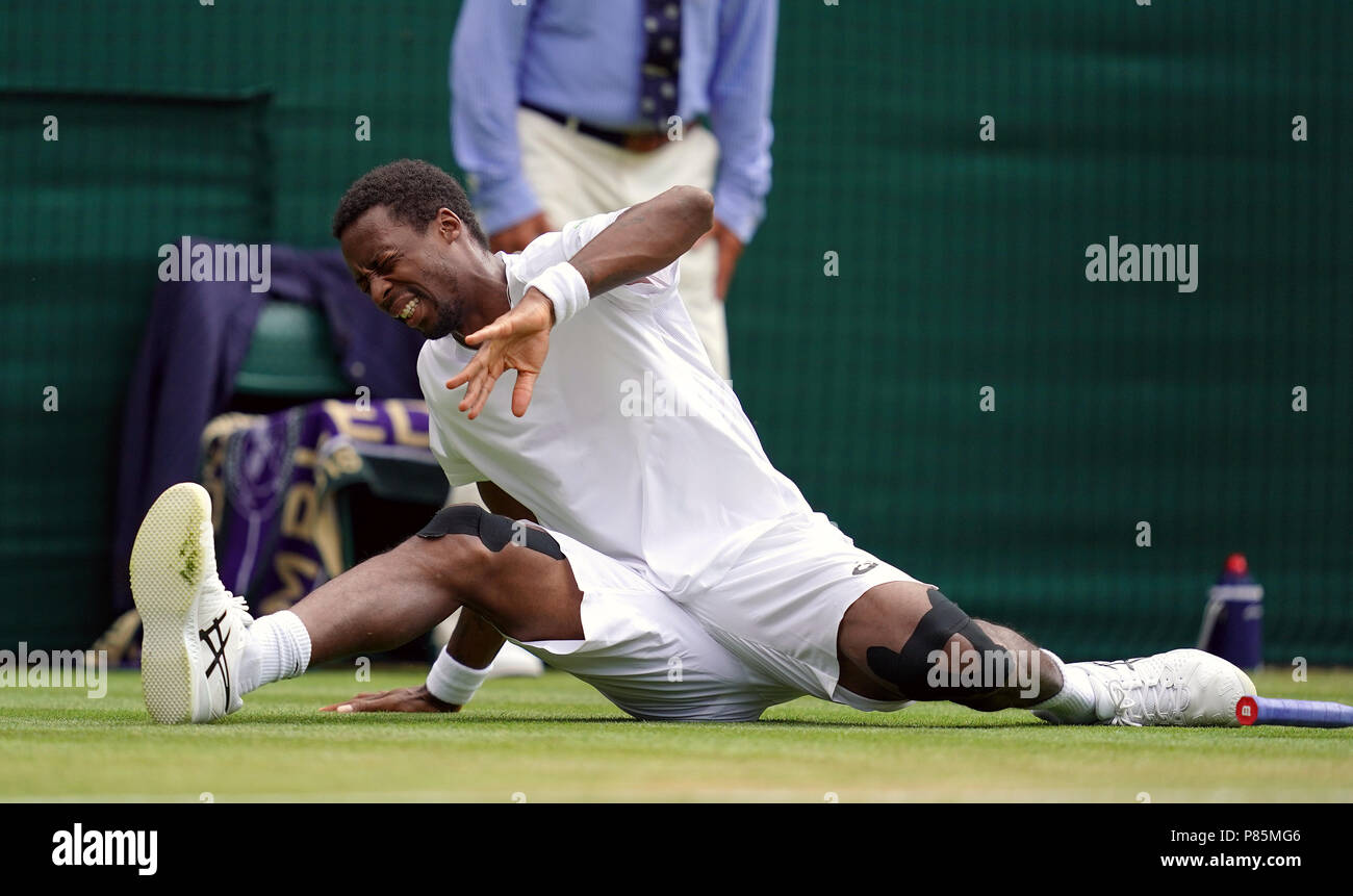 Monf Gael Monfils slips during his match on day seven of the Wimbledon ...