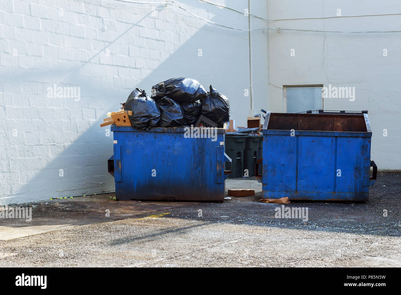 Full construction rubbish bin with loads at construction site waste