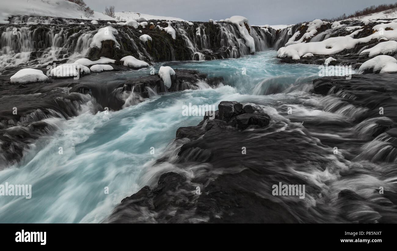 Blue Bruarfoss waterfall in winter in Iceland Stock Photo