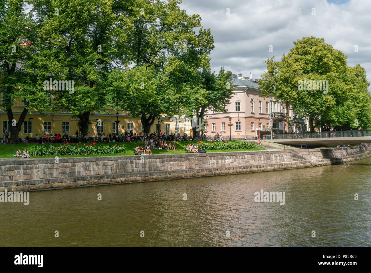 TURKU, FINLAND - 8/7/2018: People enjoying summer day by the Aura river in the old town Stock Photo