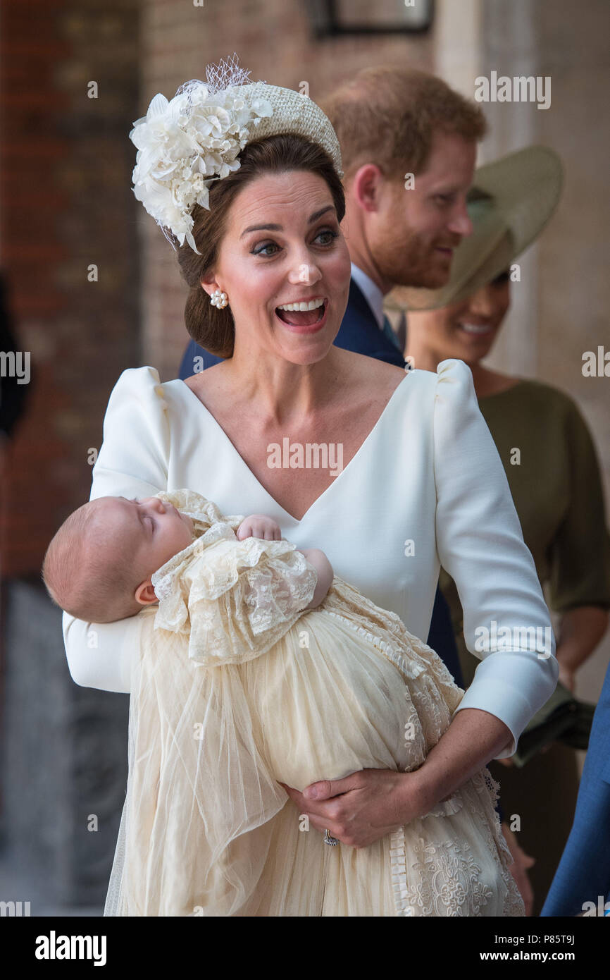 The Duchess of Cambridge carries Prince Louis as they arrive for his