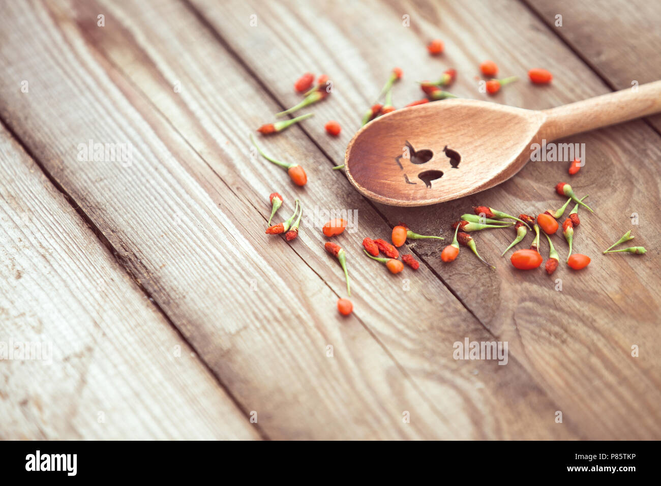 Goji berries on a wooden background Stock Photo