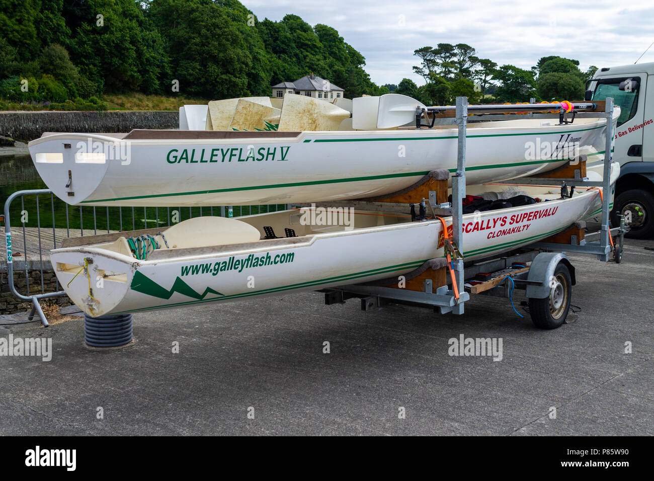 two coastal rowing boats mounted on a trailer in west cork, Ireland
