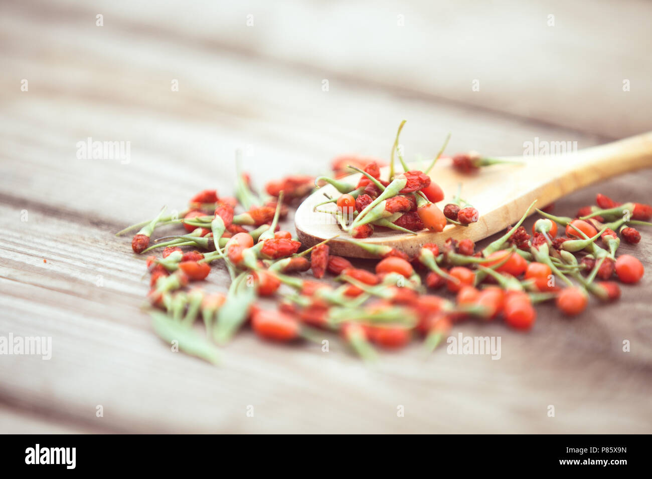 Goji berries on a wooden background Stock Photo