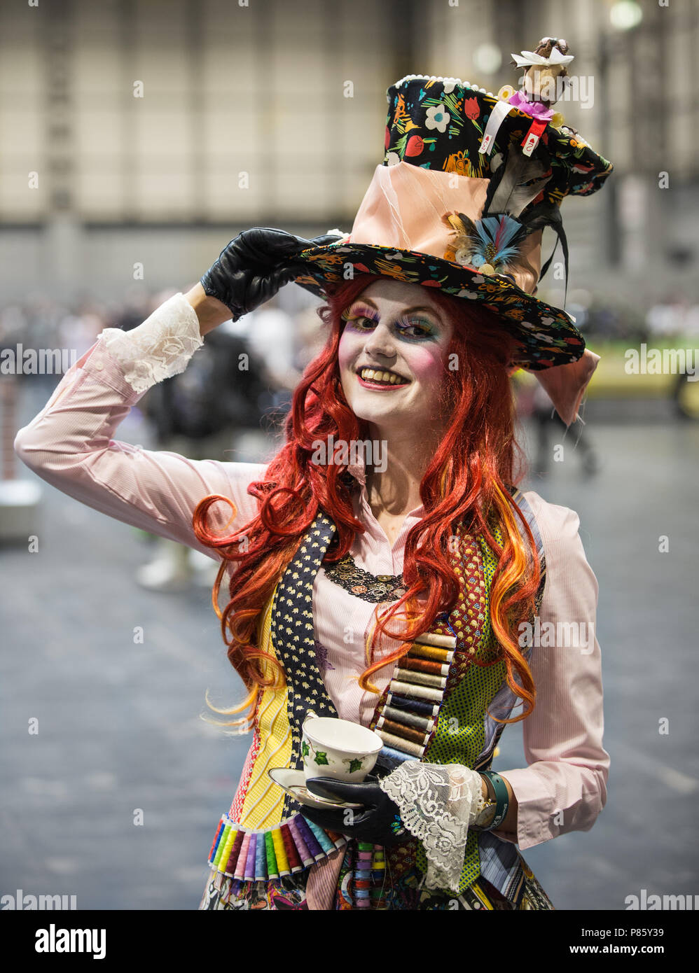 NEC, Brirmingham, UK - June 2, 2018. A girl cosplayer dressed as the Mad Hatter tea party from Alice In Wonderland at a  Collectormania comic con Stock Photo