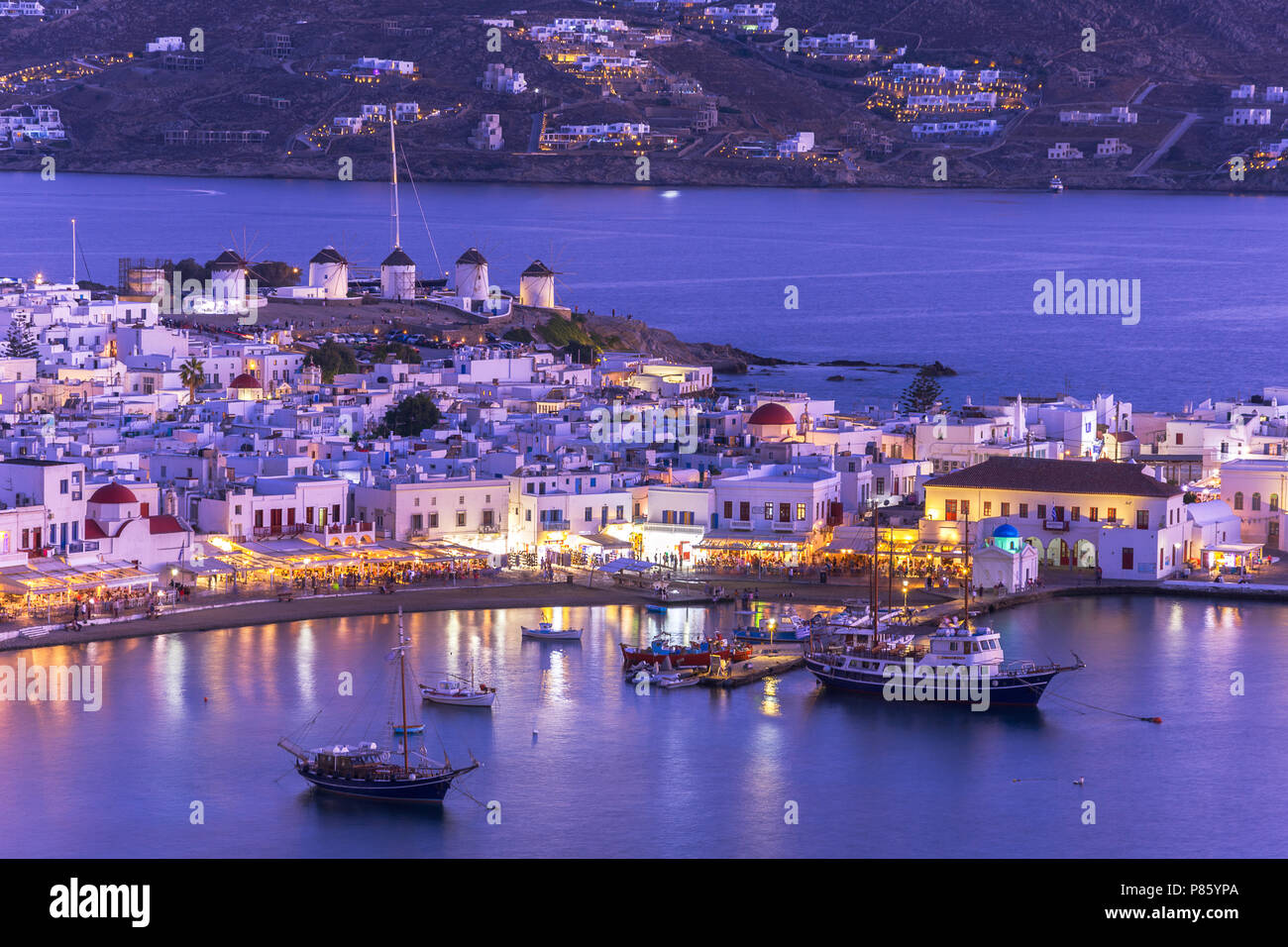 Mykonos port with boats and windmills, Cyclades islands, Greece Stock Photo