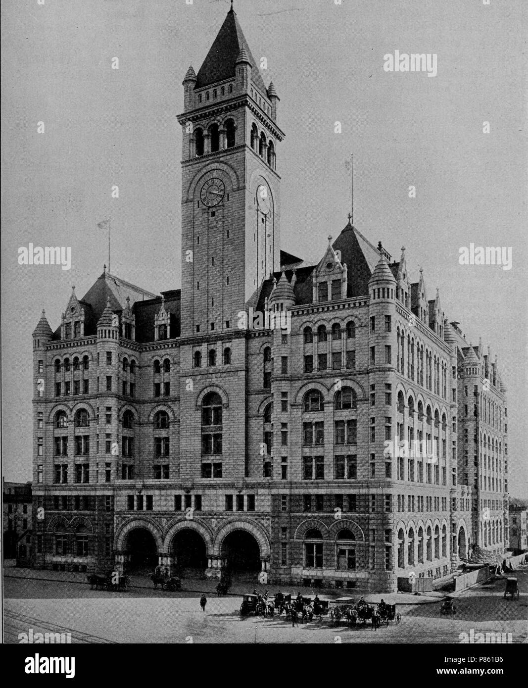 Black and white print illustrating an angled view of the Old Post Office Pavilion, a multi-level Richardsonian Romanesque structure with a tall tower over the triple-arched entrance, located at 1101 Pennsylvania Avenue in Washington DC, and currently operated by Donald Trump as the 'Trump International Hotel, Washington DC', 1903. Courtesy Internet Archive. () Stock Photo