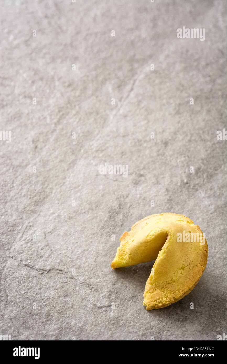 Fortune cookie on gray stone background Stock Photo