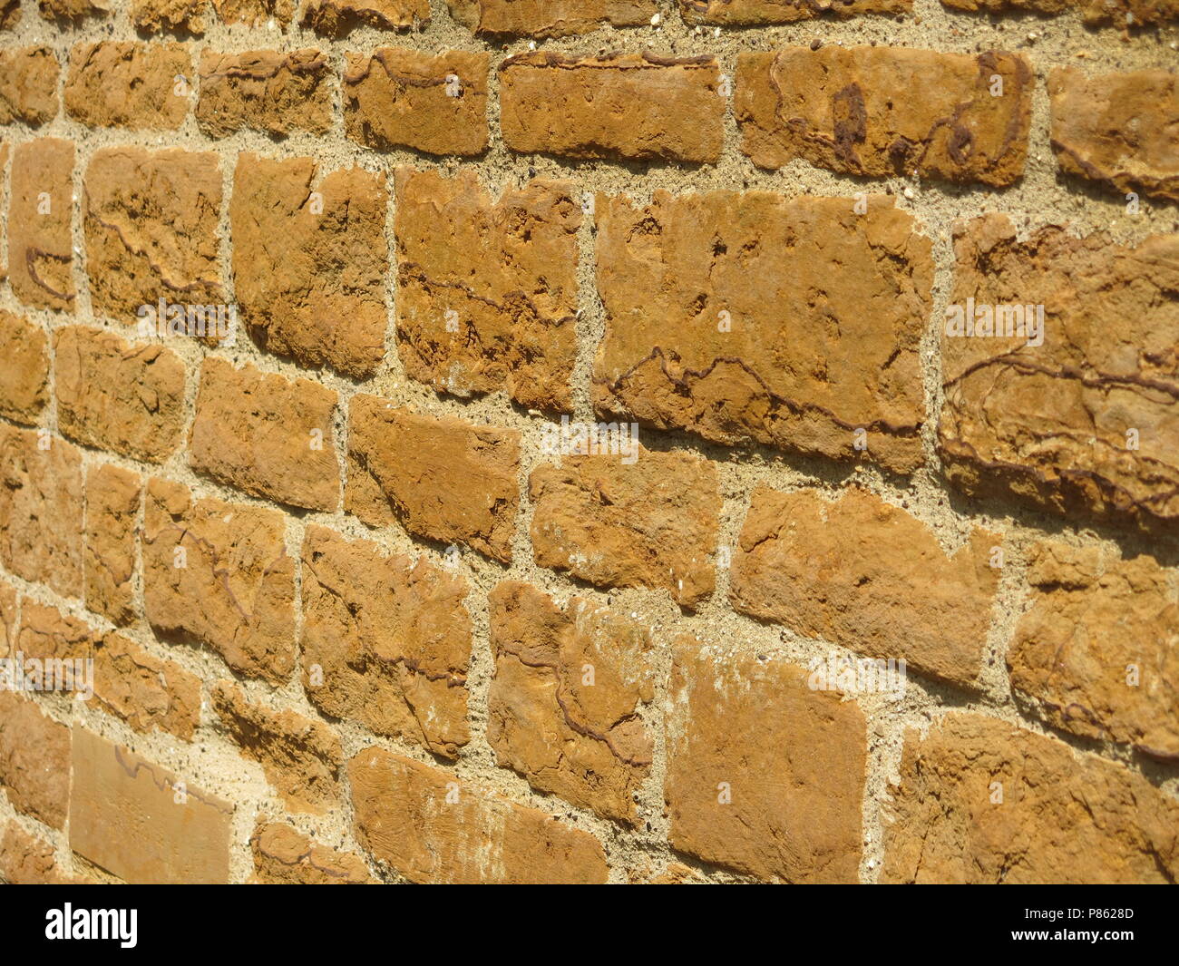 A close-up of the dressed stone blockwork at Earls Barton church, a ...
