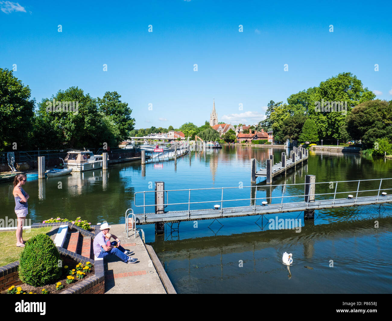 Family, at Marlow Lock, With view towards Marlow, with River Thames, All Saints Church, Jettys, Weir, Marlow, Buckinghamshire, England, UK, GB. Stock Photo