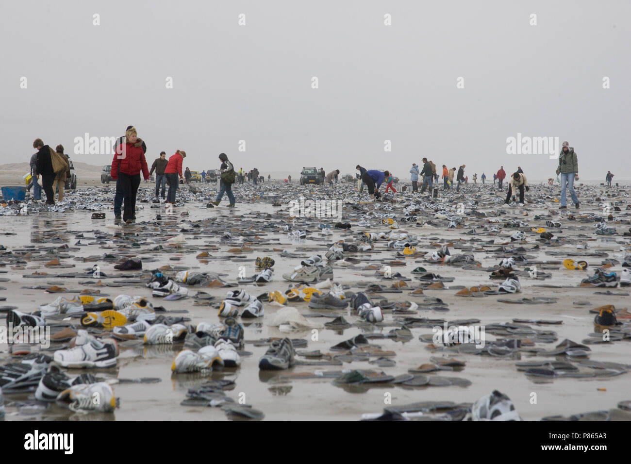 People collecting cargo spill on the beach; Strandjutters Terschelling Stock Photo
