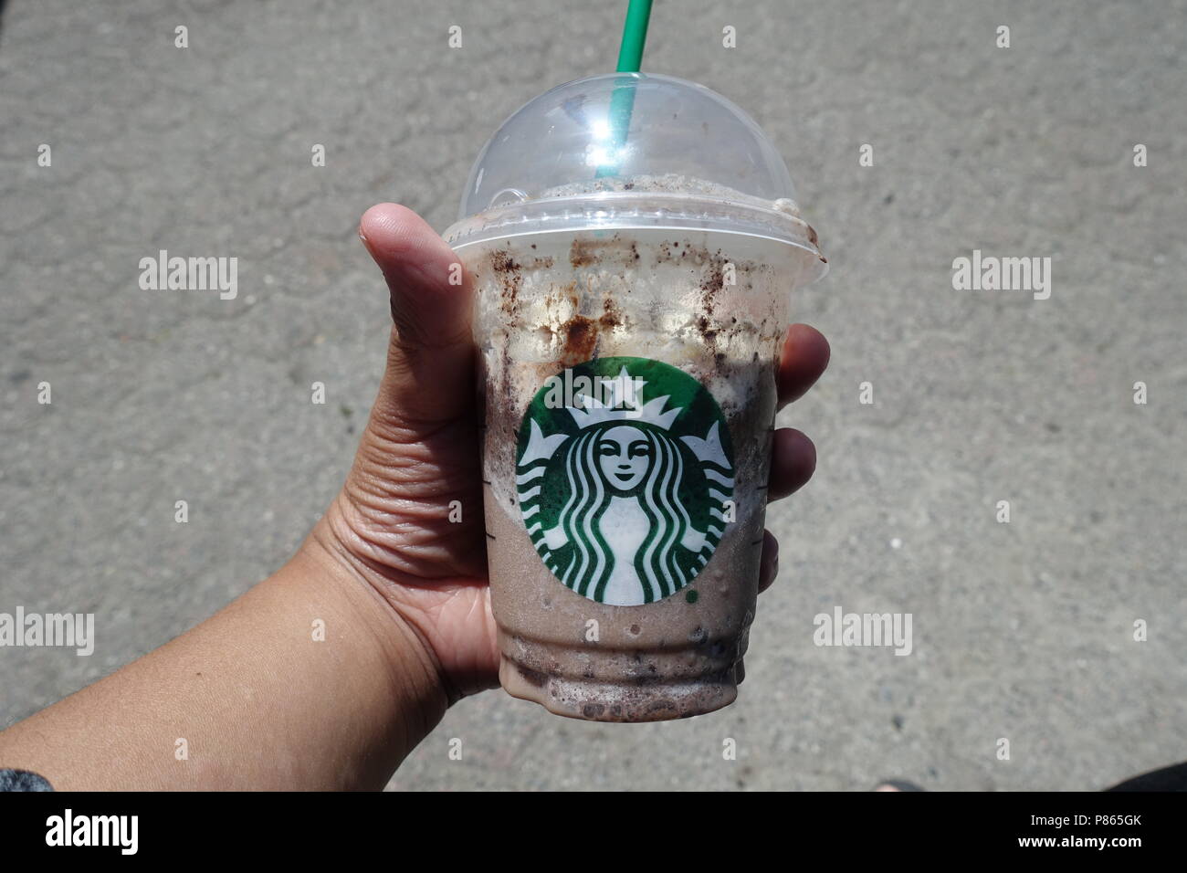 A Hand Holding Cup Of Double Chocolaty Chip Frappuccino From Starbucks Burnaby BC Canada A Hand Holding Cup Of Double Chocolaty Chip Frappuccino From Starbucks Burnaby BC Canada