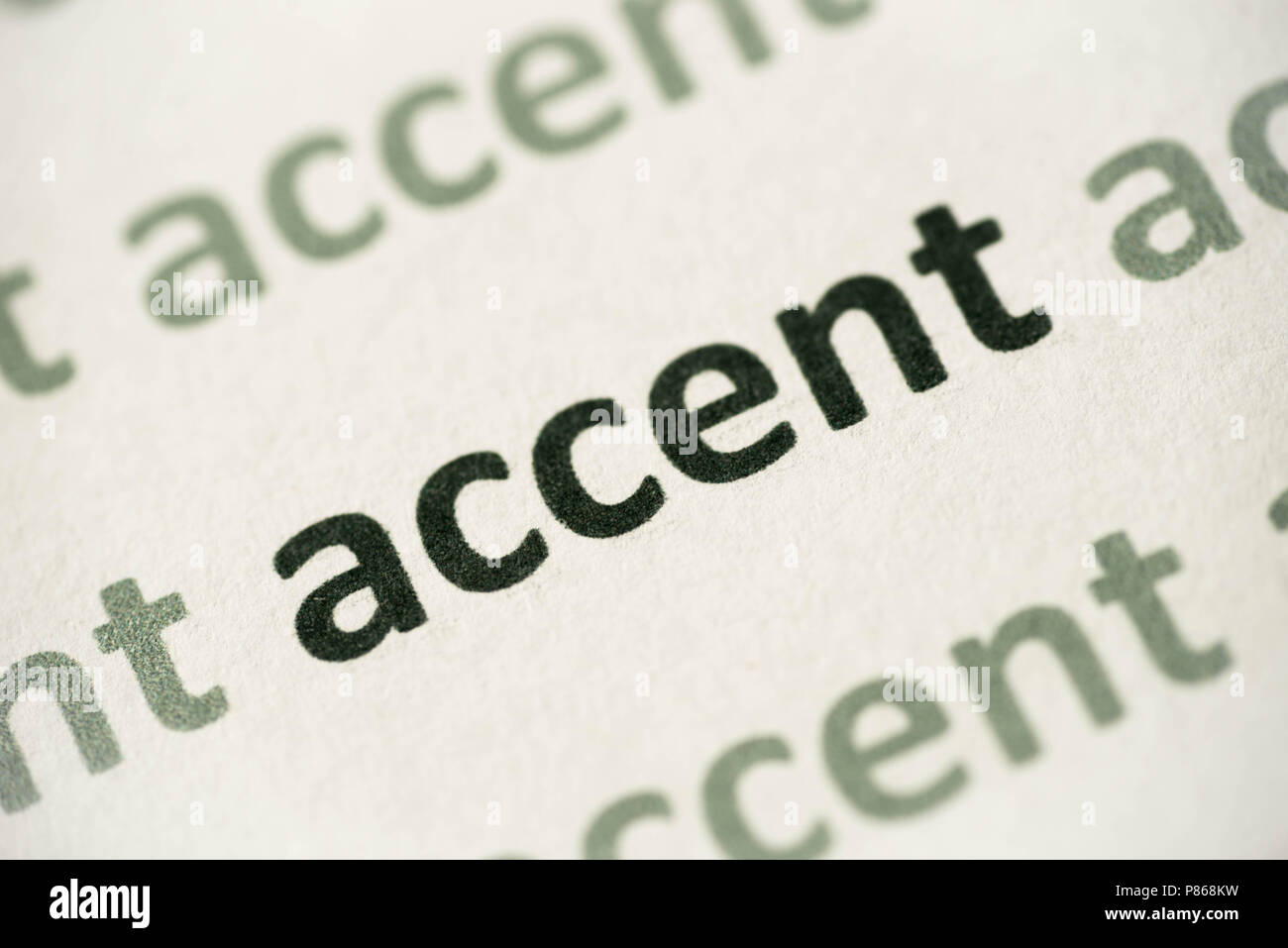 word accent printed on white paper macro Stock Photo