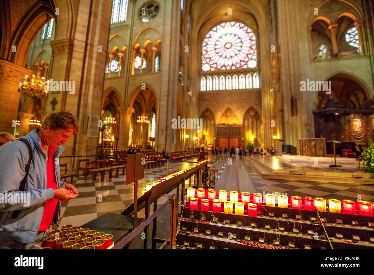 PARIS, FRANCE JULY 1, 2017 People lighting the candles in central