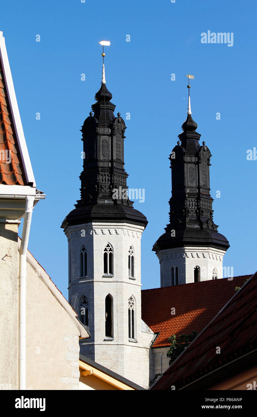 Towers of the Visby cathedral over the roof tops of medieval hanseatic town in Gotland Island, Sweden. Stock Photo