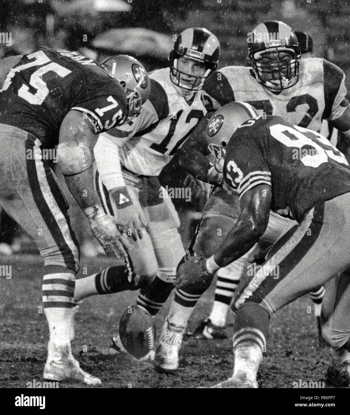 san-francisco-california-usa-27th-dec-1987-san-francisco-49ers-vs-los-angles-rams-at-candlestick-park-sunday-december-27-1987-49ers-beat-la-rams-48-0-san-francisco-defensive-end-kevin-fagan-75-and-defensive-tackle-clyde-grover-93-try-to-recover-los-angles-rams-quarterback-hugh-millen-12-ball-credit-al-golubzuma-wirealamy-live-news-P86FP7.jpg