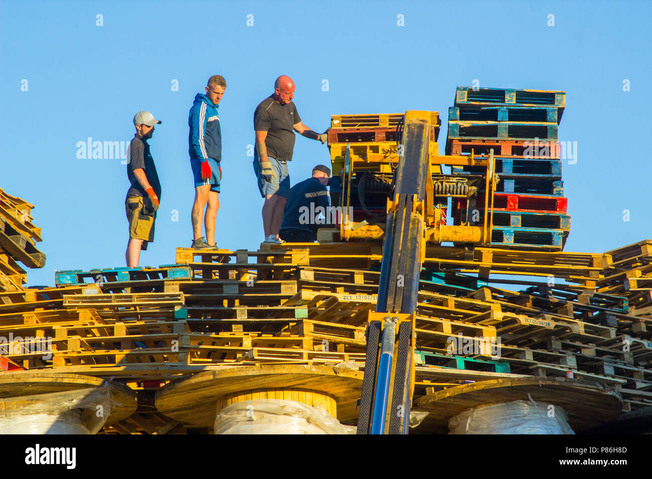 Bangor, Northern Ireland. 9th July 2018. Bonfire building on an