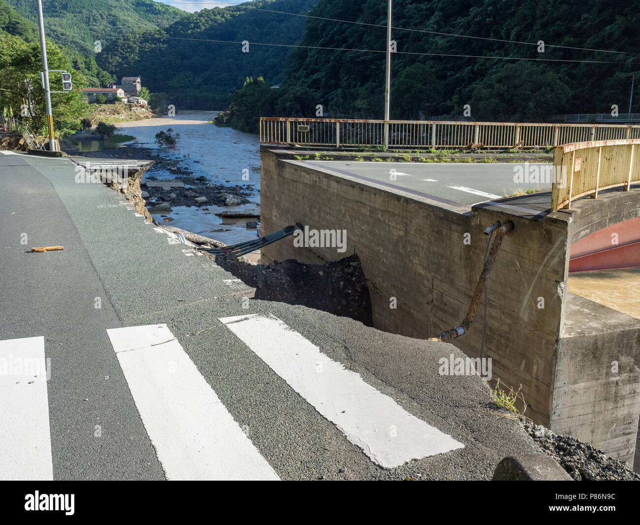 July 9, 2018, Nomura, Ehime Prefecture: The aftermath of the flood from Hijikawa river. In Seiyo City, Ehime Prefecture, the Hijikawa River flooded, leaving three men and two women dead. Local residents survey the damage and work out what to do next. (Photo by Tomohiro Takahashi/AFLO) Stock Photo