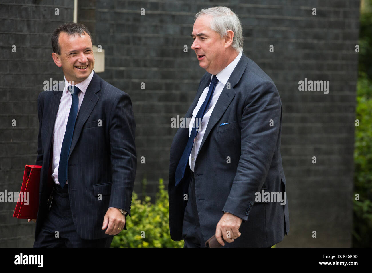 London, UK. 10th July, 2018. Alun Cairns MP, Secretary of State for Wales, and Geoffrey Cox QC MP, Attorney General, arrive at 10 Downing Street for the first Cabinet meeting since the resignations as Ministers of David Davis MP and Boris Johnson MP. Credit: Mark Kerrison/Alamy Live News Stock Photo