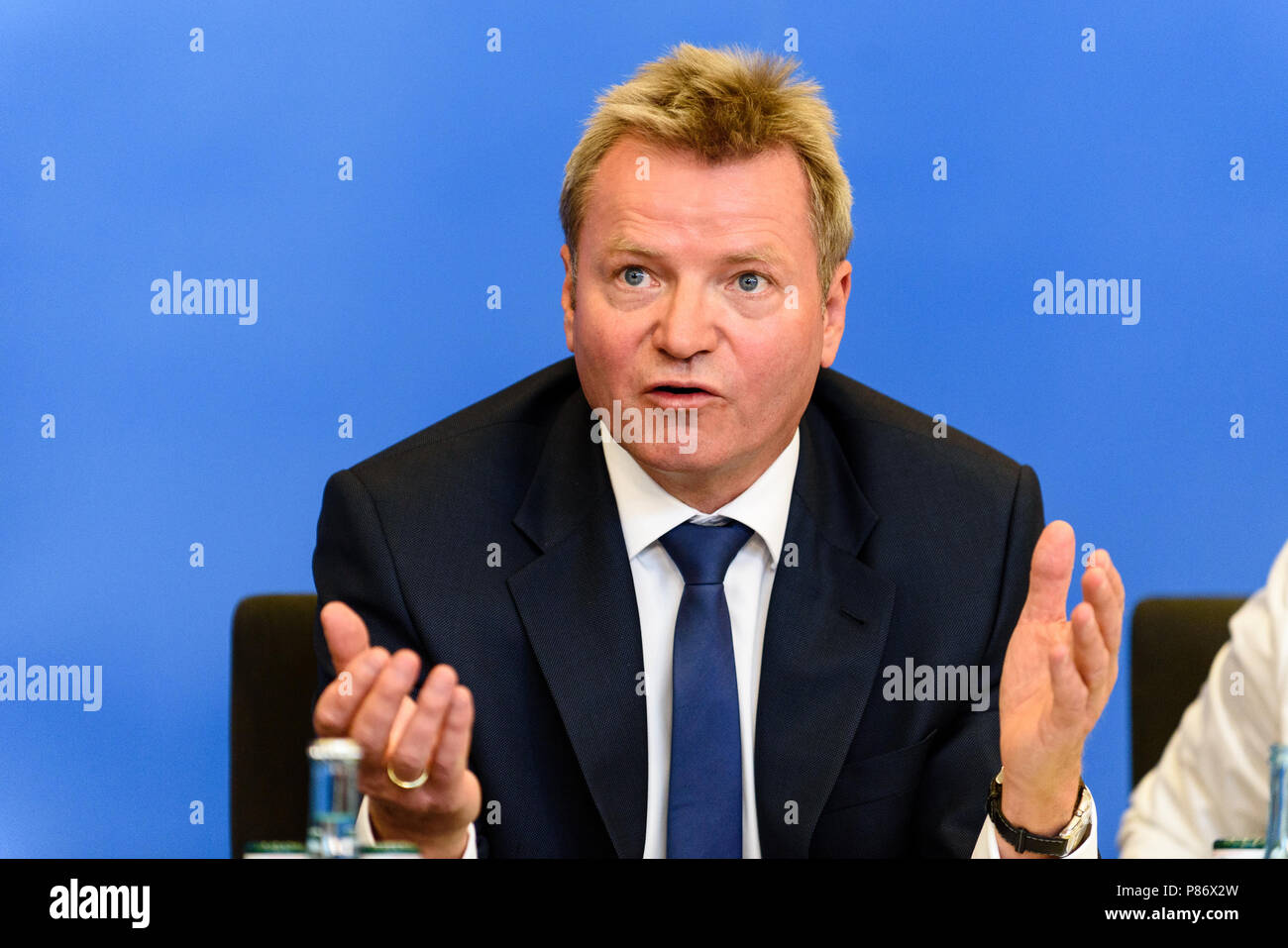 Berlin, Germany. 10th July, 2018. Minister of state at the ministry of Interior, Construction and Homeland Dr. Helmut Teichmann during the presentation of the ''Masterplan Migration - Measures to Organize, Control and Limit Immigration.'' The plan includes stopping and rejecting migrants who are already registered in other EU countries at the German border. Credit: Markus Heine/SOPA Images/ZUMA Wire/Alamy Live News Stock Photo
