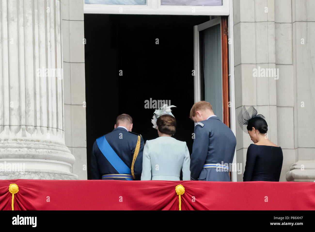 London, UK. 10th July 2018. The Duke and Duchess of Cambridge and The Duke and Duchess of Sussex enter Buckingham Palace after watching the flypast from the Balcony. The Flypast followed a parade to commemorate 100 years of the RAF Credit: amanda rose/Alamy Live News  Stock Photo
