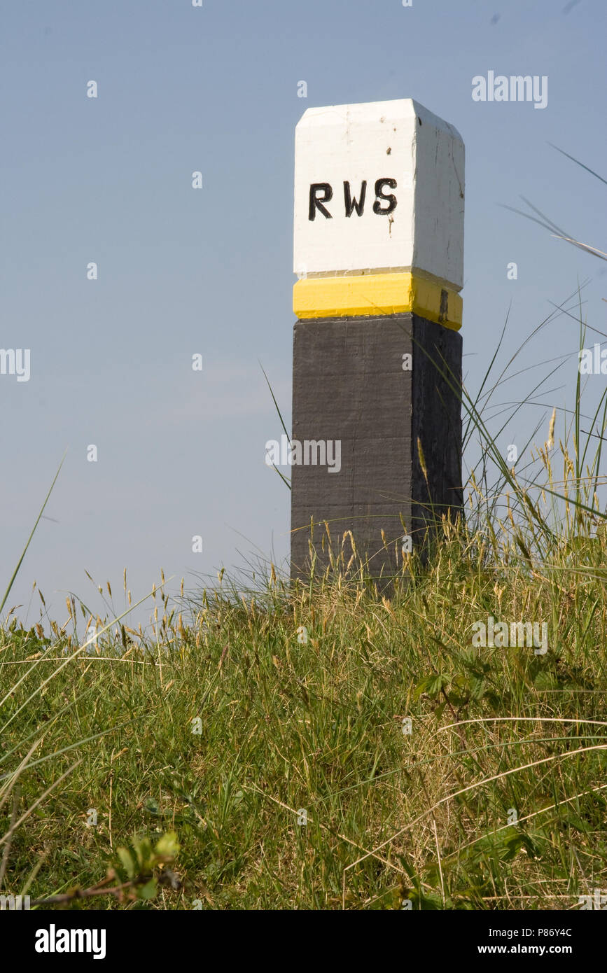 Strandpaal op Schiermonnikoog; Pole on Schiermonnikoog Stock Photo