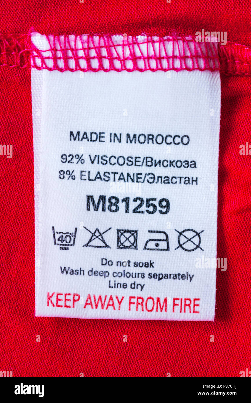 label in garment Made in Morocco 92% viscose 8% elastane - keep away from fire with wash care symbols instructions Stock Photo