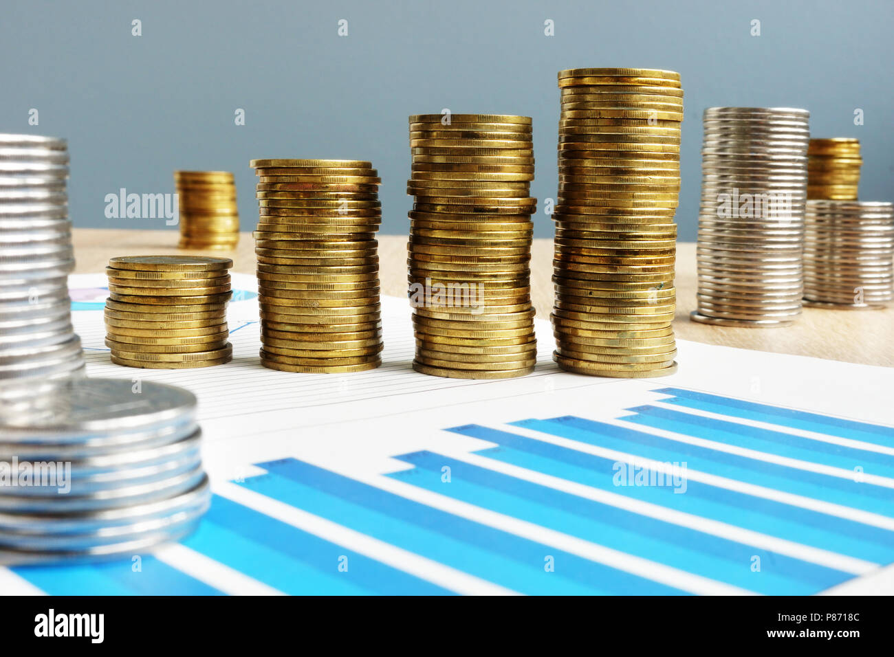 Business success. Profit. Stack of coins and financial chart. Stock Photo