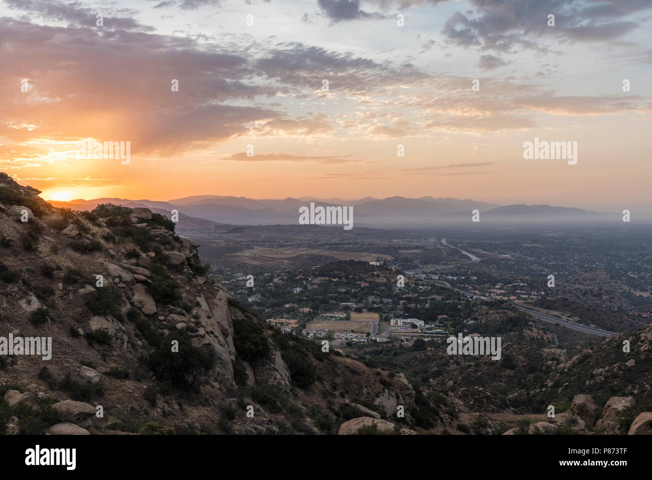 Sunrise view of Porter Ranch in the San Fernando Valley area of Los Angeles, California.  Shot from Rocky Peak Mountain Park. Stock Photo