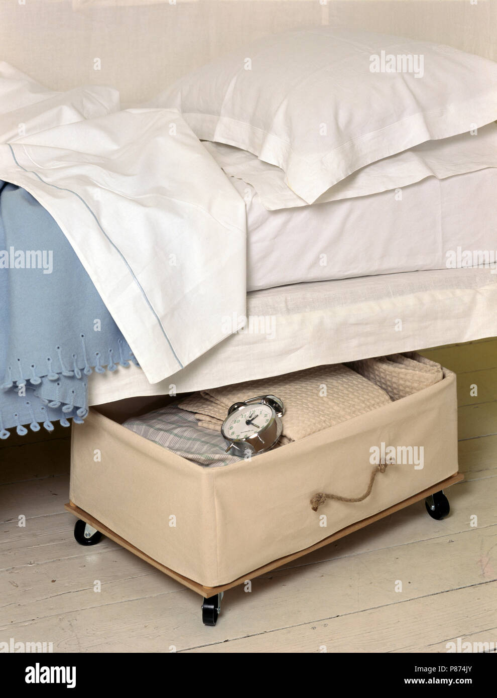 Canvas Storage Drawer On Casters Below Bed With Crisp White