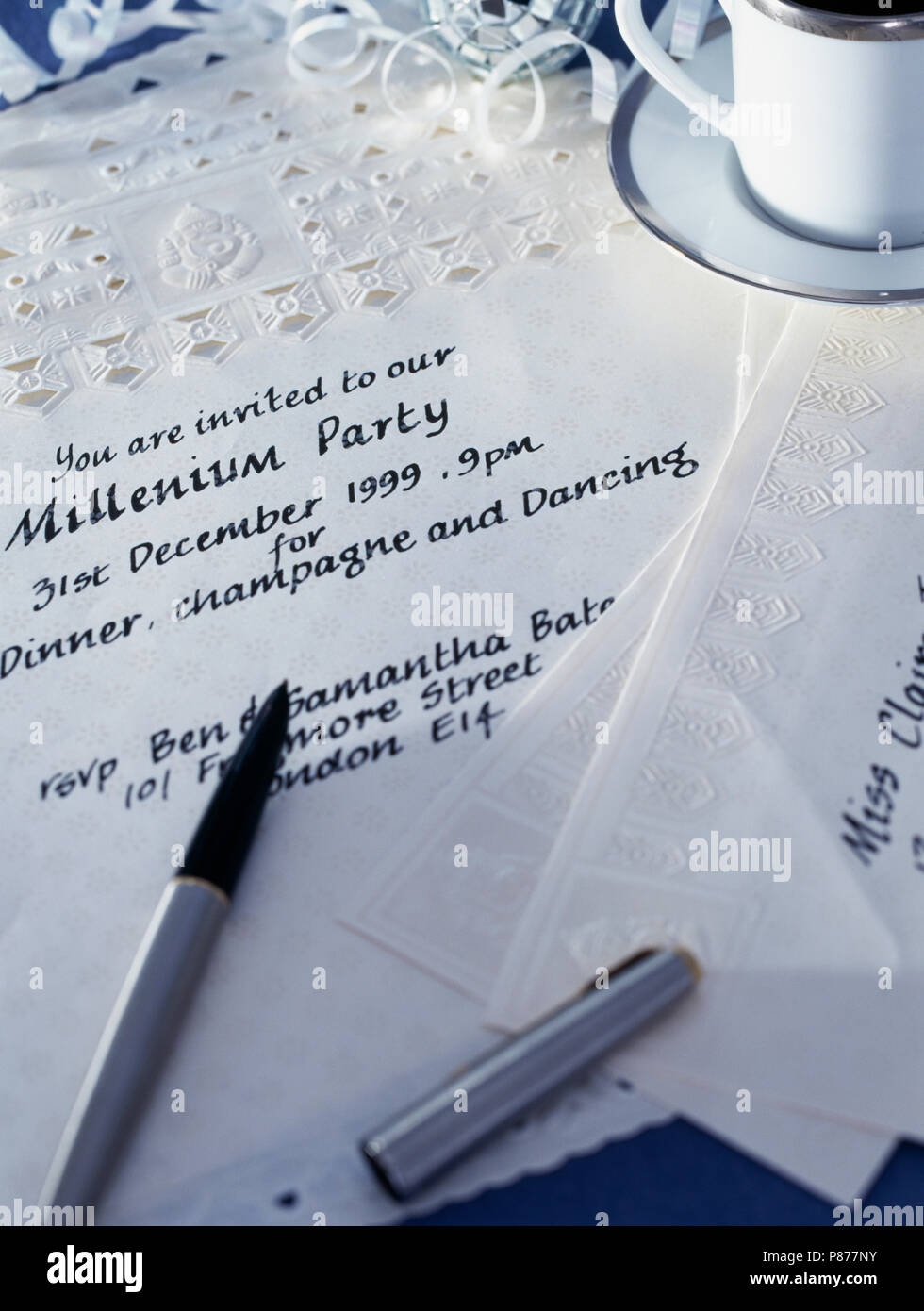 Close-up of fountain pen with hand written Millenium Party invitation Stock Photo