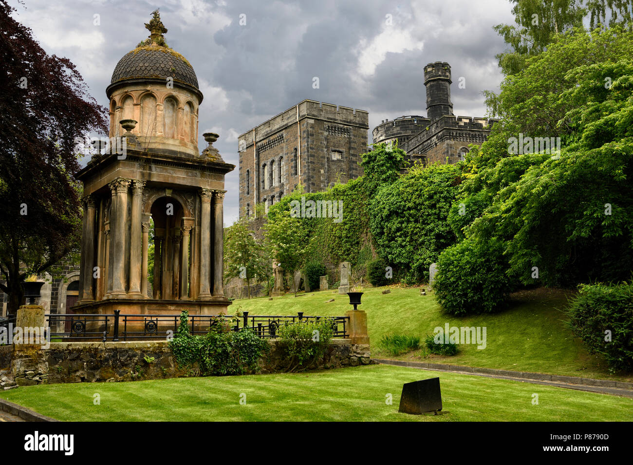 Monument and tomb of Rev Ebenezer Erskine and other gravestones at Stirling Youth Hostel with Old Town Jail in Stirling Scotland UK Stock Photo