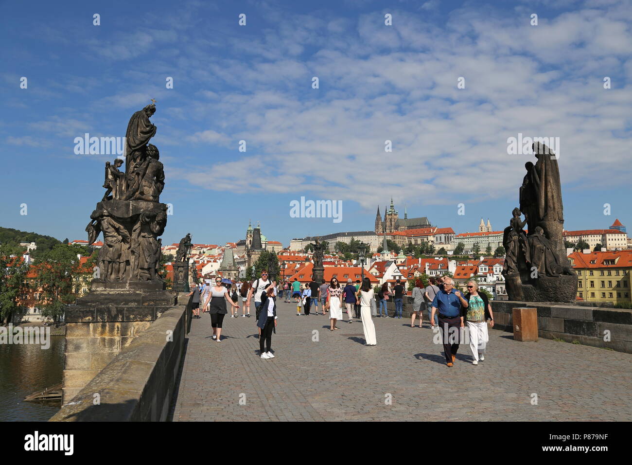 Statues of St Francis Xavier (left) and St Cyril and St Methodius (right), Charles Bridge, Prague, Czechia (Czech Republic), Europe Stock Photo