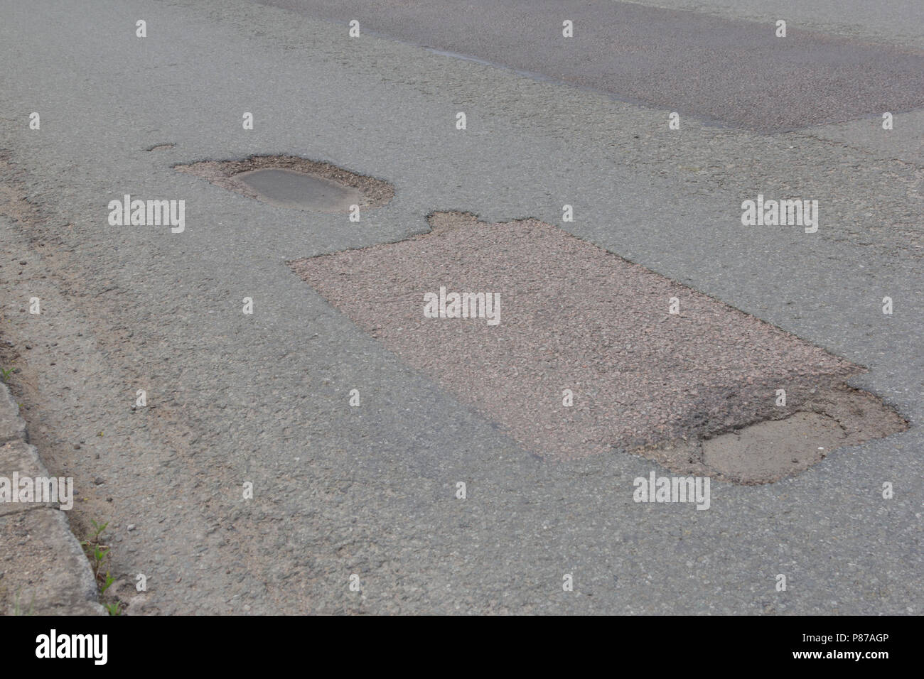 Pot holes in Carterton, Oxfordshire UK. 13th May 2018. UK Weather Pot