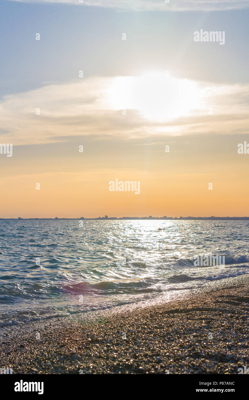 Beautiful summer sunset with clouds over the sea Stock Photo - Alamy