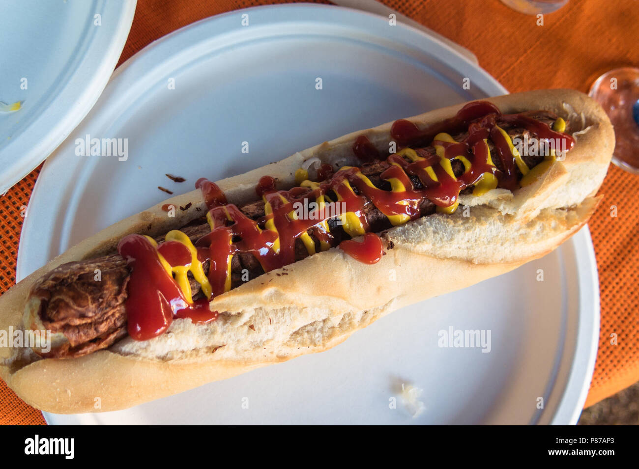 Bratwurst sausage on a paper plate Stock Photo