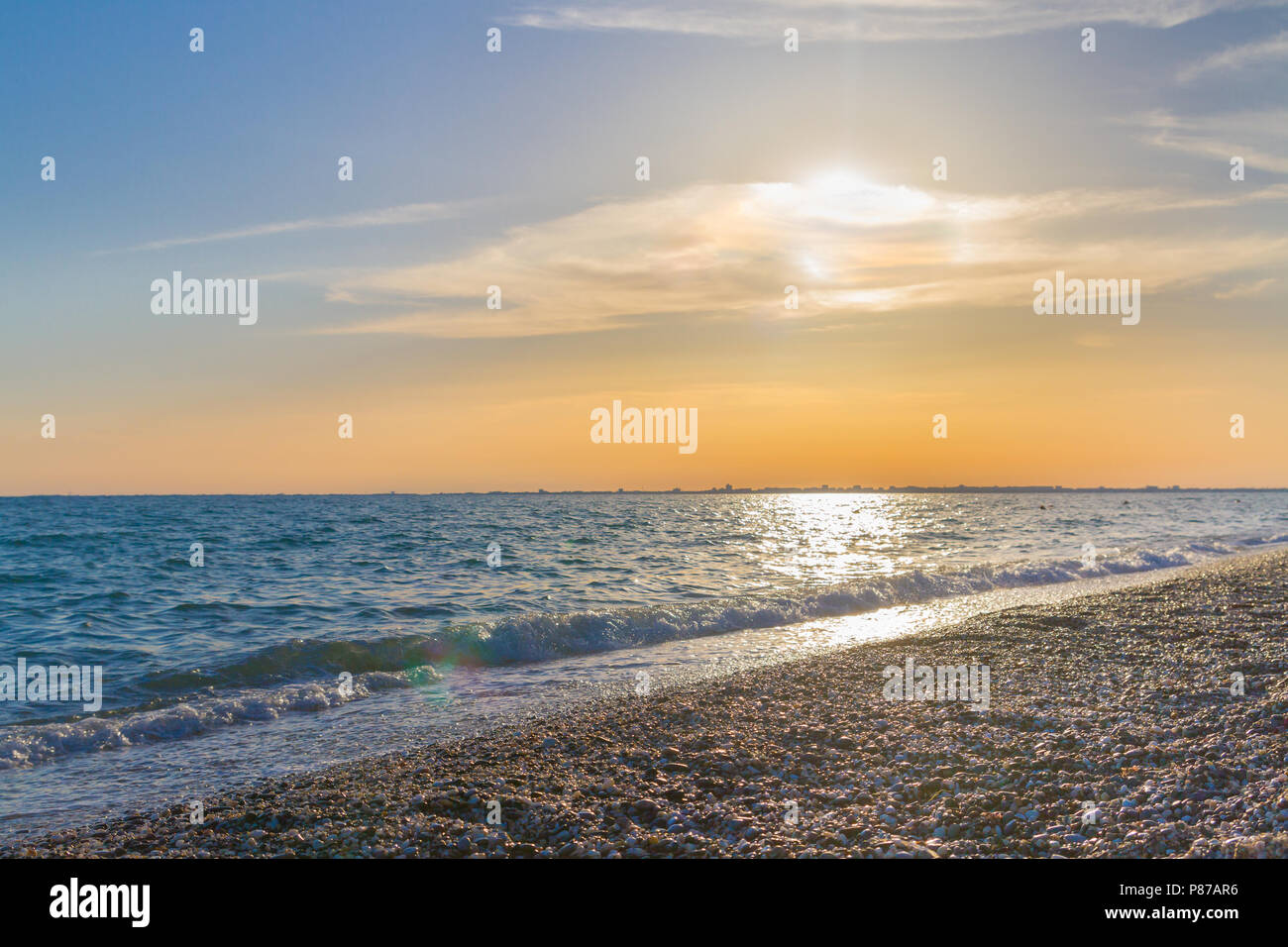 Beautiful summer sunset with clouds over the sea Stock Photo - Alamy