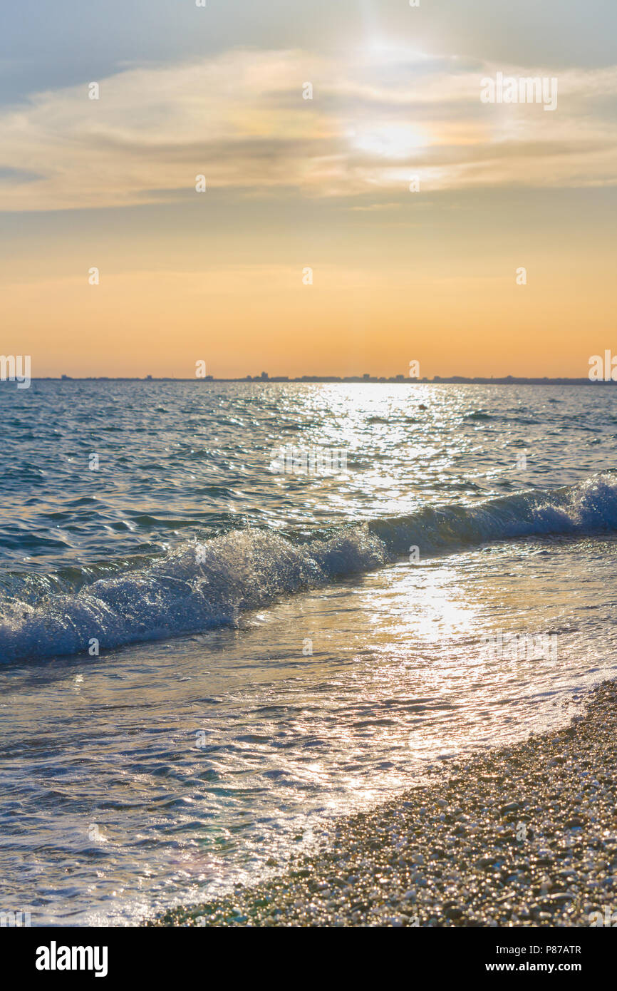 Beautiful summer sunset with clouds over the sea Stock Photo - Alamy
