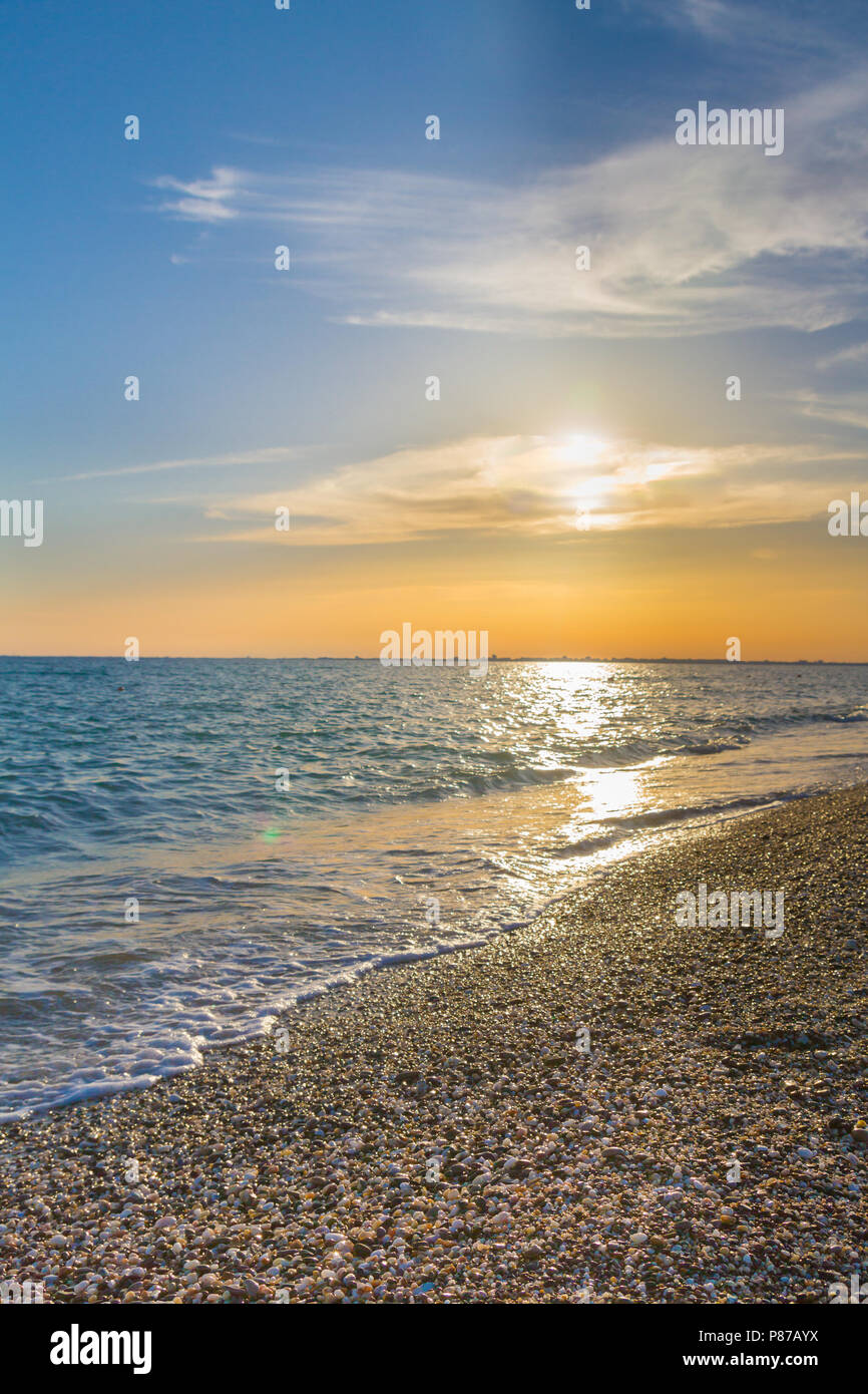Beautiful summer sunset with clouds over the sea Stock Photo - Alamy