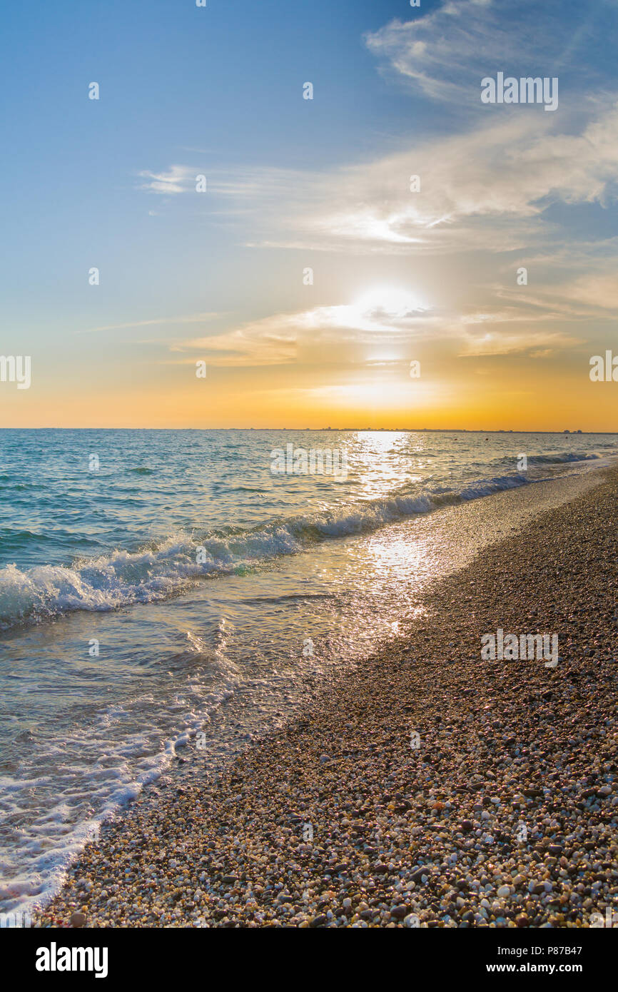 Beautiful summer sunset with clouds over the sea Stock Photo - Alamy