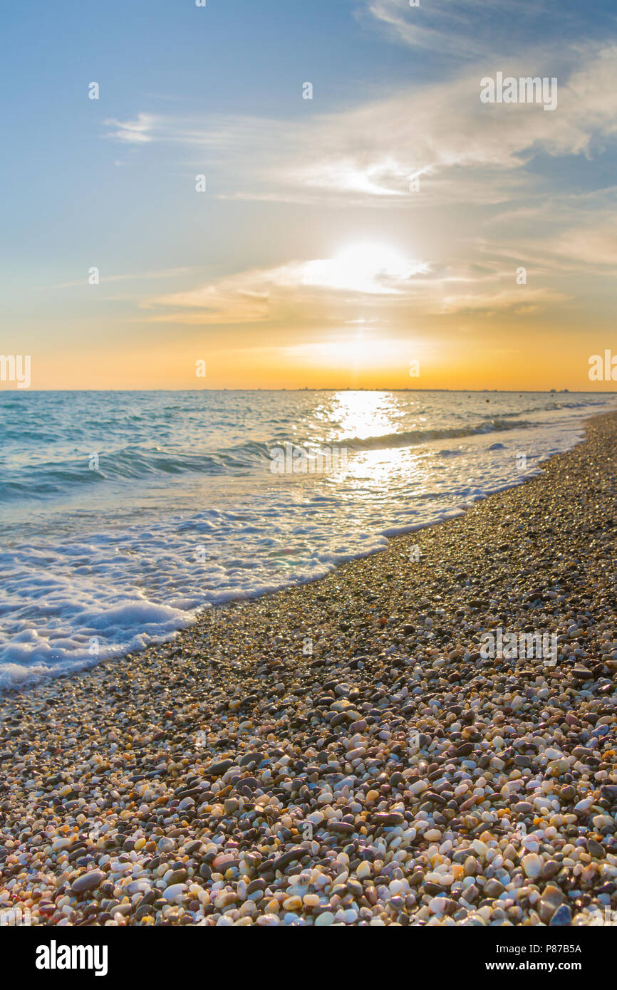 Beautiful summer sunset with clouds over the sea Stock Photo - Alamy